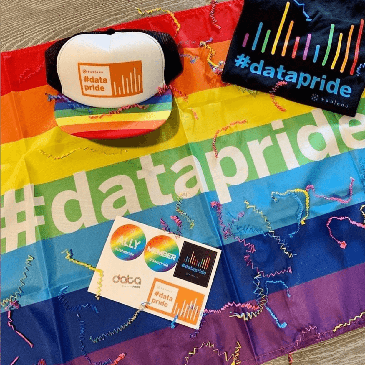 Tableau Pride gear including hat, flag, T-shirt, and stickers