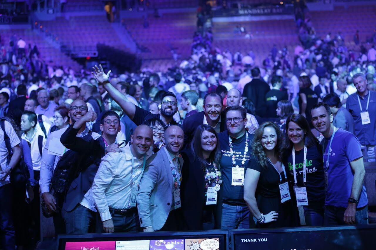 crowd of cheering people in a dark arena