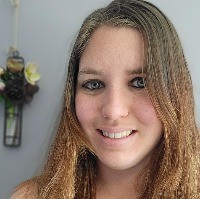 Smiling, Caucasian woman with light brown hair 