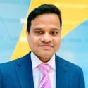 Headshot of Suresh Martha, Head of Data-Driven Innovation and Analytics at EMD Serono, the healthcare business of Merck KGaA, Darmstadt, Germany in the US, against a bright blue and yellow background.